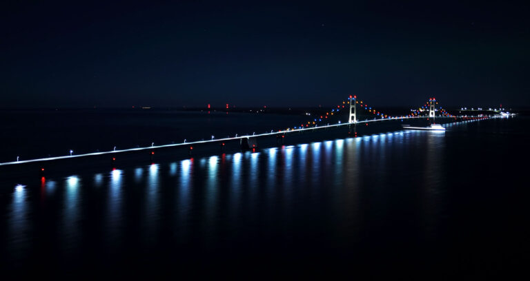 mackinac bridge at night northern lights ship passing 768x408